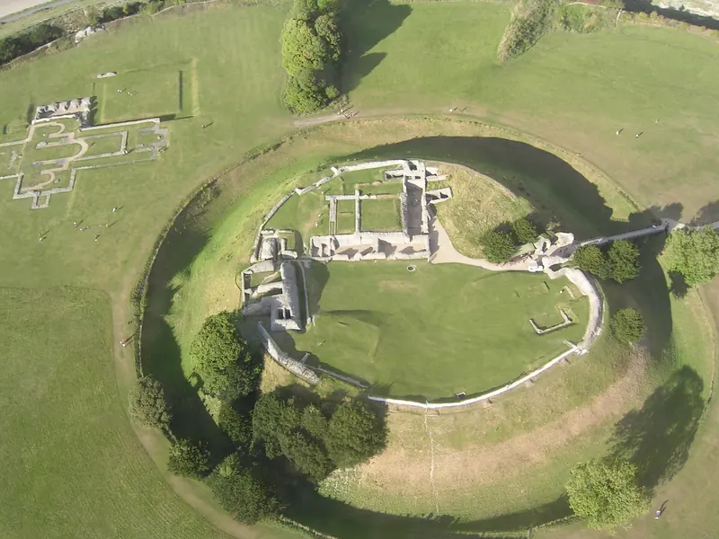 Aerial view of Old Sarum, with the castle ruins on the central mound, the ring ditch around it and the outline of the old cathedral